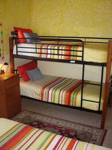 Bunkbeds share the second bedroom with a double bed